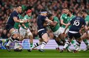 16 March 2024; Bundee Aki of Ireland is tackled by Rory Darge of Scotland the Guinness Six Nations Rugby Championship match between Ireland and Scotland at the Aviva Stadium in Dublin. Photo by Brendan Moran/Sportsfile