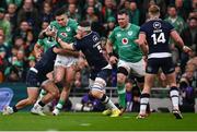 16 March 2024; Dan Sheehan of Ireland is tackled by Ben White, left, Scott Cummings of Scotland during the Guinness Six Nations Rugby Championship match between Ireland and Scotland at the Aviva Stadium in Dublin. Photo by Brendan Moran/Sportsfile