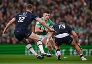16 March 2024; Calvin Nash of Ireland in action against Stafford McDowall, left, and Huw Jones of Scotland during the Guinness Six Nations Rugby Championship match between Ireland and Scotland at the Aviva Stadium in Dublin. Photo by Brendan Moran/Sportsfile