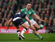 16 March 2024; James Lowe of Ireland in action against Kyle Steyn of Scotland during the Guinness Six Nations Rugby Championship match between Ireland and Scotland at the Aviva Stadium in Dublin. Photo by Brendan Moran/Sportsfile
