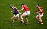 16 March 2024; Liam Óg McGovern of Wexford in action against Robert Downey and Darragh Fitzgibbon of Cork during the Allianz Hurling League Division 1 Group A match between Wexford and Cork at Chadwicks Wexford Park in Wexford. Photo by Ray McManus/Sportsfile