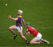 16 March 2024; Gareth Kirby of Wexford wins possession ahead of Seamus Harnedy of Cork during the Allianz Hurling League Division 1 Group A match between Wexford and Cork at Chadwicks Wexford Park in Wexford. Photo by Ray McManus/Sportsfile