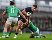 16 March 2024; Huw Jones of Scotland is tackled by Jamison Gibson-Park of Ireland during the Guinness Six Nations Rugby Championship match between Ireland and Scotland at the Aviva Stadium in Dublin. Photo by Sam Barnes/Sportsfile