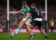 16 March 2024; Jack Crowley of Ireland kicks while under pressure from Pierre Schoeman of Scotland during the Guinness Six Nations Rugby Championship match between Ireland and Scotland at the Aviva Stadium in Dublin. Photo by Harry Murphy/Sportsfile