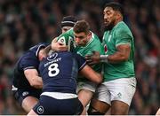 16 March 2024; Jordan Larmour of Ireland is tackled by Jack Dempsey of Scotland during the Guinness Six Nations Rugby Championship match between Ireland and Scotland at the Aviva Stadium in Dublin. Photo by Brendan Moran/Sportsfile