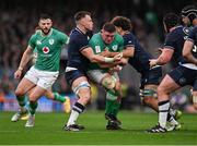 16 March 2024; Tadhg Furlong of Ireland is tackled by Jack Dempsey of Scotland, left, and Andy Christie during the Guinness Six Nations Rugby Championship match between Ireland and Scotland at the Aviva Stadium in Dublin. Photo by Brendan Moran/Sportsfile