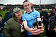16 March 2024; Brian Fenton of Dublin takes a selfie with a supporter after the Allianz Football League Division 1 match between Galway and Dublin at Pearse Stadium in Galway. Photo by Stephen McCarthy/Sportsfile