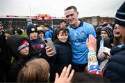 16 March 2024; Brian Fenton of Dublin takes a selfie with a supporter after the Allianz Football League Division 1 match between Galway and Dublin at Pearse Stadium in Galway. Photo by Stephen McCarthy/Sportsfile