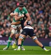 16 March 2024; Caelan Doris of Ireland is tackled by Scott Cummings and Grant Gilchrist of Scotland during the Guinness Six Nations Rugby Championship match between Ireland and Scotland at the Aviva Stadium in Dublin. Photo by Brendan Moran/Sportsfile
