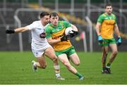 16 March 2024; Shane O'Donnell of Donegal in action against Ryan Houlihan of Kildare during the Allianz Football League Division 2 match between Kildare and Donegal at Netwatch Cullen Park in Carlow. Photo by Matt Browne/Sportsfile