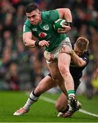 16 March 2024; Dan Sheehan of Ireland is tackled by Kyle Steyn of Scotland during the Guinness Six Nations Rugby Championship match between Ireland and Scotland at the Aviva Stadium in Dublin. Photo by Brendan Moran/Sportsfile