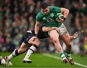 16 March 2024; Dan Sheehan of Ireland is tackled by Kyle Steyn of Scotland during the Guinness Six Nations Rugby Championship match between Ireland and Scotland at the Aviva Stadium in Dublin. Photo by Brendan Moran/Sportsfile