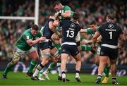 16 March 2024; Peter O’Mahony of Ireland is tackled by Jack Dempsey, left, and Huw Jones of Scotland during the Guinness Six Nations Rugby Championship match between Ireland and Scotland at the Aviva Stadium in Dublin. Photo by Brendan Moran/Sportsfile