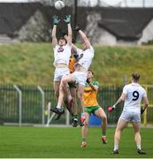 16 March 2024; Kevin Feely and Aaron Masterson of Kildare in action against Caolam McGonagle and Michael Langan of Donegal during the Allianz Football League Division 2 match between Kildare and Donegal at Netwatch Cullen Park in Carlow. Photo by Matt Browne/Sportsfile