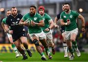 16 March 2024; Bundee Aki of Ireland makes a break during the Guinness Six Nations Rugby Championship match between Ireland and Scotland at the Aviva Stadium in Dublin. Photo by Harry Murphy/Sportsfile