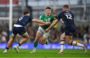 16 March 2024; Calvin Nash of Ireland is tackled by Ben White, left, and Stafford McDowall of Scotland during the Guinness Six Nations Rugby Championship match between Ireland and Scotland at the Aviva Stadium in Dublin. Photo by Sam Barnes/Sportsfile