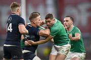 16 March 2024; Duhan van der Merwe of Scotland is tackled by Jordan Larmour of Ireland during the Guinness Six Nations Rugby Championship match between Ireland and Scotland at the Aviva Stadium in Dublin. Photo by Harry Murphy/Sportsfile