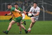 16 March 2024; Alex Beirne of Kildare in action against Patrick McBrearty of Donegal during the Allianz Football League Division 2 match between Kildare and Donegal at Netwatch Cullen Park in Carlow. Photo by Matt Browne/Sportsfile