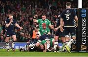 16 March 2024; Ireland players, Josh van der Flier, bottom, and Rónan Kelleher celebrate after team-mate Andrew Porter, hidden, score their side's second try during the Guinness Six Nations Rugby Championship match between Ireland and Scotland at the Aviva Stadium in Dublin. Photo by Harry Murphy/Sportsfile