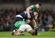 16 March 2024; Cameron Redpath of Scotland is tackled by Bundee Aki, left, and Robbie Henshaw of Ireland during the Guinness Six Nations Rugby Championship match between Ireland and Scotland at the Aviva Stadium in Dublin. Photo by Sam Barnes/Sportsfile