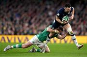 16 March 2024; Blair Kinghorn of Scotland is tackled by Robbie Henshaw of Ireland during the Guinness Six Nations Rugby Championship match between Ireland and Scotland at the Aviva Stadium in Dublin. Photo by Brendan Moran/Sportsfile