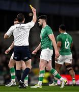 16 March 2024; Harry Byrne of Ireland is shown a yellow card by referee Matthew Carley during the Guinness Six Nations Rugby Championship match between Ireland and Scotland at the Aviva Stadium in Dublin. Photo by Harry Murphy/Sportsfile