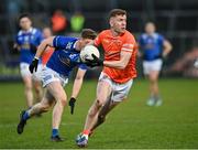 16 March 2024; Ross McQuillan of Armagh in action against Ciarán Brady of Cavan during the Allianz Football League Division 2 match between Armagh and Cavan at BOX-IT Athletic Grounds in Armagh. Photo by Oliver McVeigh/Sportsfile