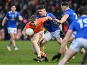 16 March 2024; Andrew Murnin of Armagh in action against Ciarán Brady of Cavan during the Allianz Football League Division 2 match between Armagh and Cavan at BOX-IT Athletic Grounds in Armagh. Photo by Oliver McVeigh/Sportsfile