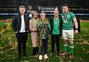 16 March 2024; Joe McCarthy of Ireland celebrates with his family, from left, brother Paddy, mother Paula, brother Andrew and father Joe after his side's victory in the Guinness Six Nations Rugby Championship match between Ireland and Scotland at the Aviva Stadium in Dublin. Photo by Harry Murphy/Sportsfile