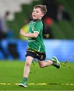 16 March 2024; Theo O'Mahony son of Ireland captain Peter O'Mahony runs around with the winners medal after the Guinness Six Nations Rugby Championship match between Ireland and Scotland at the Aviva Stadium in Dublin. Photo by Brendan Moran/Sportsfile