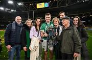 16 March 2024; Josh van der Flier of Ireland with his family and the trophy after his side's victory in the Guinness Six Nations Rugby Championship match between Ireland and Scotland at the Aviva Stadium in Dublin. Photo by Harry Murphy/Sportsfile