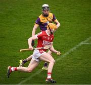 16 March 2024; Shane Barrett of Cork is tackled by Eoin Ryan of Wexford during the Allianz Hurling League Division 1 Group A match between Wexford and Cork at Chadwicks Wexford Park in Wexford. Photo by Ray McManus/Sportsfile