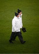 16 March 2024; Two umpires make their way to their posts before the Allianz Hurling League Division 1 Group A match between Wexford and Cork at Chadwicks Wexford Park in Wexford. Photo by Ray McManus/Sportsfile