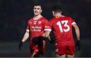16 March 2024; Darragh Canavan, left, and Darren McCurry of Tyrone share a joke during the Allianz Football League Division 1 match between Tyrone and Monaghan at O'Neills Healy Park in Omagh, Tyrone.  Photo by Ramsey Cardy/Sportsfile