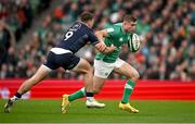 16 March 2024; Jordan Larmour of Ireland in action against Ben White of Scotland during the Guinness Six Nations Rugby Championship match between Ireland and Scotland at the Aviva Stadium in Dublin. Photo by Brendan Moran/Sportsfile