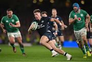 16 March 2024; Huw Jones of Scotland on the way to scoring his side's first try during the Guinness Six Nations Rugby Championship match between Ireland and Scotland at the Aviva Stadium in Dublin. Photo by Brendan Moran/Sportsfile