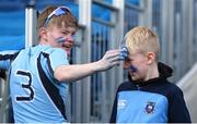 17 March 2024; A St Michael's College supporter receives face paint before the Bank of Ireland Leinster Schools Senior Cup final match between Blackrock College and St Michael's College at the RDS Arena in Dublin. Photo by Shauna Clinton/Sportsfile