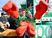 17 March 2024; Team Ireland athletes Aidan Walsh, left, and Michaela Walsh are pictured as Team Ireland and PTSB take part in the St. Patrick’s Day Parade on the streets of Dublin as part of the celebrations of 100 years of Team Ireland competing at the Olympic Games. Photo by Tyler Miller/Sportsfile