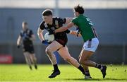 17 March 2024; Odhran Murdock of Down in action against Andy McCormack of Westmeath during the Allianz Football League Division 3 match between Westmeath and Down at TEG Cusack Park in Mullingar, Westmeath. Photo by Seb Daly/Sportsfile