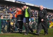 17 March 2024; Jason Foley of Kerry is assisted off the pitch after sustaining an injury during the Allianz Football League Division 1 match between Roscommon and Kerry at Dr Hyde Park in Roscommon. Photo by Ben McShane/Sportsfile