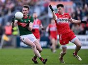 17 March 2024; Matthew Ruane of Mayo in action against Gareth McKinless of Derry during the Allianz Football League Division 1 match between Mayo and Derry at Hastings Insurance MacHale Park in Castlebar, Mayo. Photo by Piaras Ó Mídheach/Sportsfile
