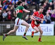 17 March 2024; Niall Loughlin of Derry in action against Bob Tuohy of Mayo during the Allianz Football League Division 1 match between Mayo and Derry at Hastings Insurance MacHale Park in Castlebar, Mayo. Photo by Piaras Ó Mídheach/Sportsfile