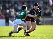 17 March 2024; Daniel Guinness of Down in action against Stephen Smith of Westmeath during the Allianz Football League Division 3 match between Westmeath and Down at TEG Cusack Park in Mullingar, Westmeath. Photo by Seb Daly/Sportsfile
