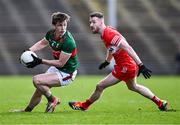 17 March 2024; Sam Callinan of Mayo in action against Niall Loughlin of Derry during the Allianz Football League Division 1 match between Mayo and Derry at Hastings Insurance MacHale Park in Castlebar, Mayo. Photo by Piaras Ó Mídheach/Sportsfile