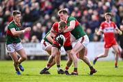 17 March 2024; Brendan Rogers of Derry in action against Matthew Ruane of Mayo, right, during the Allianz Football League Division 1 match between Mayo and Derry at Hastings Insurance MacHale Park in Castlebar, Mayo. Photo by Piaras Ó Mídheach/Sportsfile