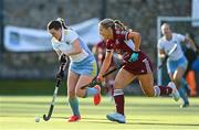 17 March 2024; Mikayla Power of UCD LHC in action against Lisa Mulcahy of Loreto HC during the Jacqui Potter Cup final match between UCD LHC and Loreto HC at Three Rock Rovers Hockey Club in Rathfarnham, Dublin. Photo by Tyler Miller/Sportsfile