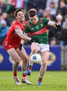 17 March 2024; Fergal Boland of Mayo in action against Conor McCluskey of Derry during the Allianz Football League Division 1 match between Mayo and Derry at Hastings Insurance MacHale Park in Castlebar, Mayo. Photo by Piaras Ó Mídheach/Sportsfile