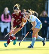 17 March 2024; Lauren Johnston of UCD LHC in action against Hannah McLoughlin of Loreto HC during the Jacqui Potter Cup final match between UCD LHC and Loreto HC at Three Rock Rovers Hockey Club in Rathfarnham, Dublin. Photo by Tyler Miller/Sportsfile