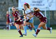 17 March 2024; Sarah McAuley of UCD LHC in action against Lisa Mulcahy of Loreto HC, left, and Grace Donald during the Jacqui Potter Cup final match between UCD LHC and Loreto HC at Three Rock Rovers Hockey Club in Rathfarnham, Dublin. Photo by Tyler Miller/Sportsfile