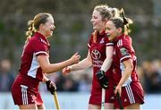17 March 2024; Hannah Matthews of Loreto HC, centre, celebrates with team-mates Aisling Murray, left, and Mia Jennings after scoring their side's second goal during the Jacqui Potter Cup final match between UCD LHC and Loreto HC at Three Rock Rovers Hockey Club in Rathfarnham, Dublin. Photo by Tyler Miller/Sportsfile *** NO REPRODUCTION FEE ***